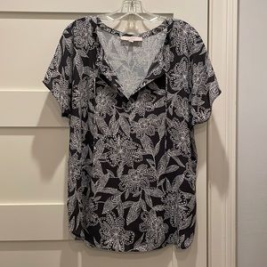 Blue and white flowered top with neck ties and flutter sleeves